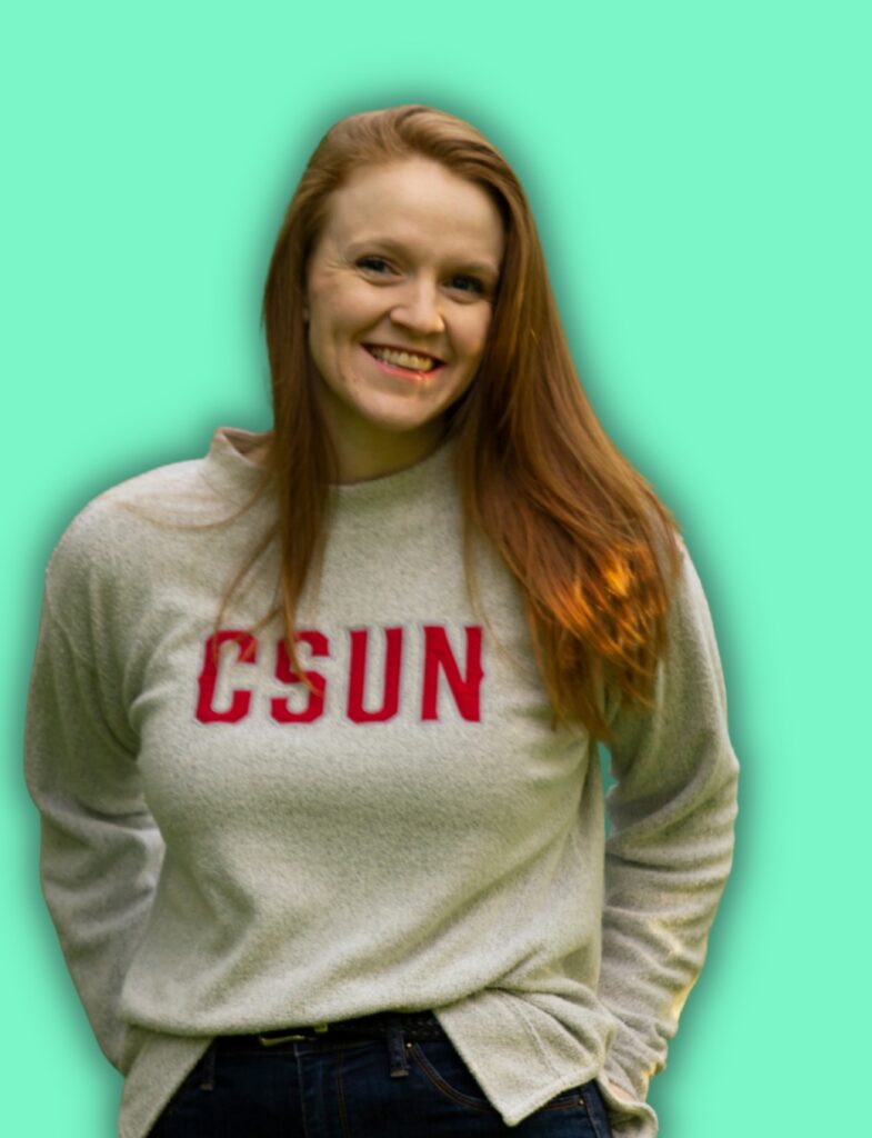 Rebecca, a Lyon Content writer, wearing a CSUN shirt with a green backdrop