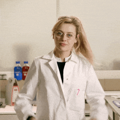 A Gif of a woman scientist doing the mind explosion gesture.