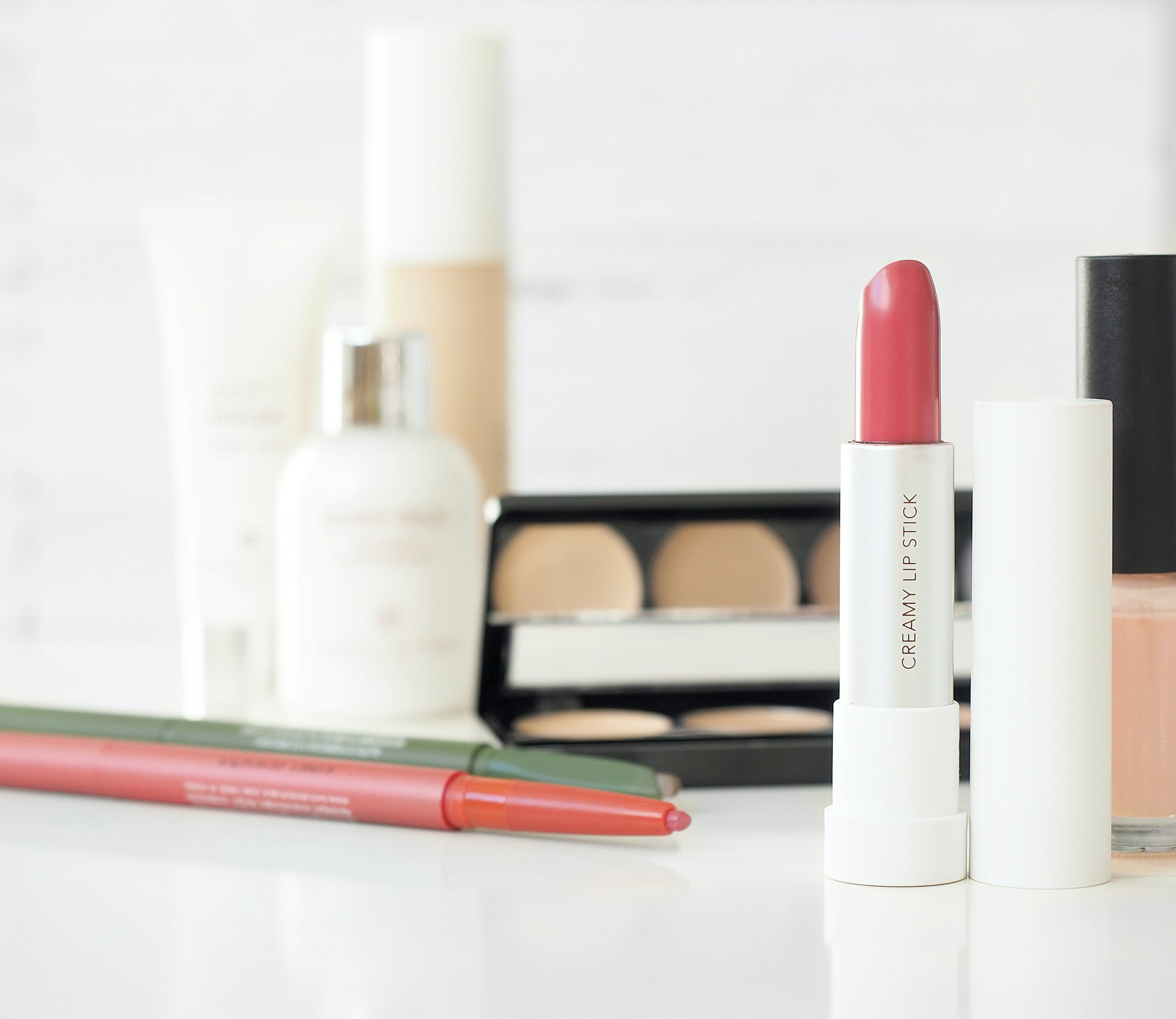 Beauty Blog post image featuring makeup on a counter.