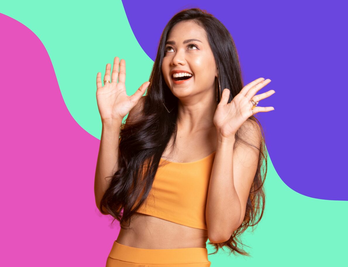 woman waves hands excitedly in front of colorful swirling background for featured image on post about best digital marketing agencies