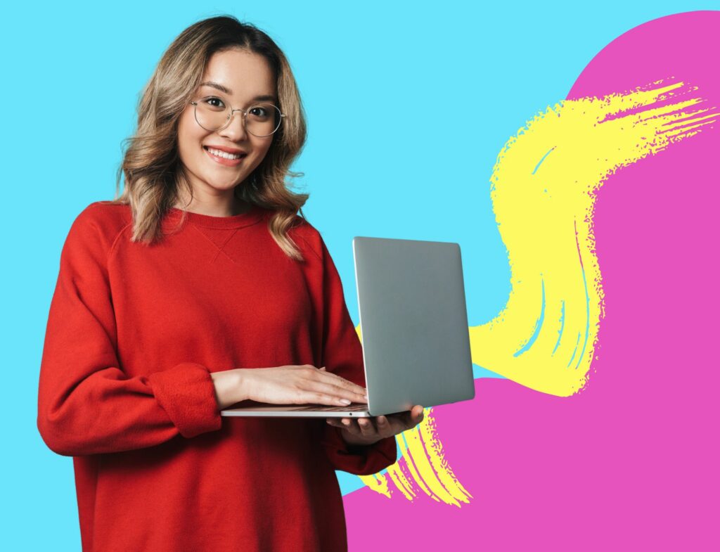 woman in red sweater smiles and holds laptop in front of swirling background for post about digital marketing