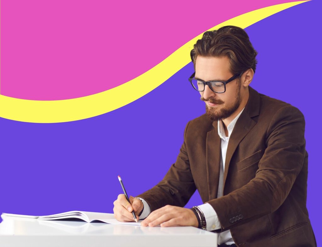 man in glasses writes a checklist in front of colorful background