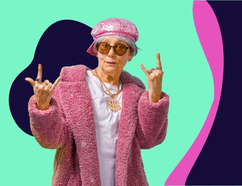 cool grandma making rock on sign of the horns hand gesture in front of colorful background