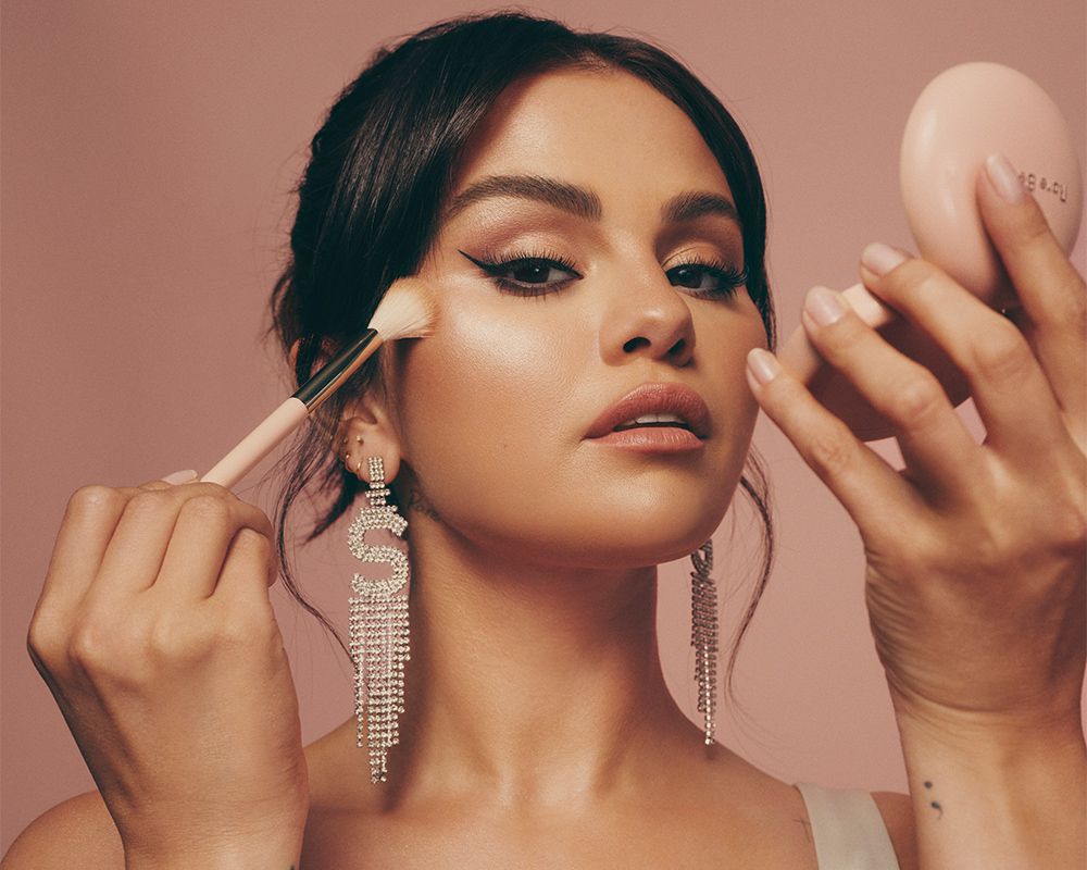 Selena Gomez applying Rare Beauty in brand photo