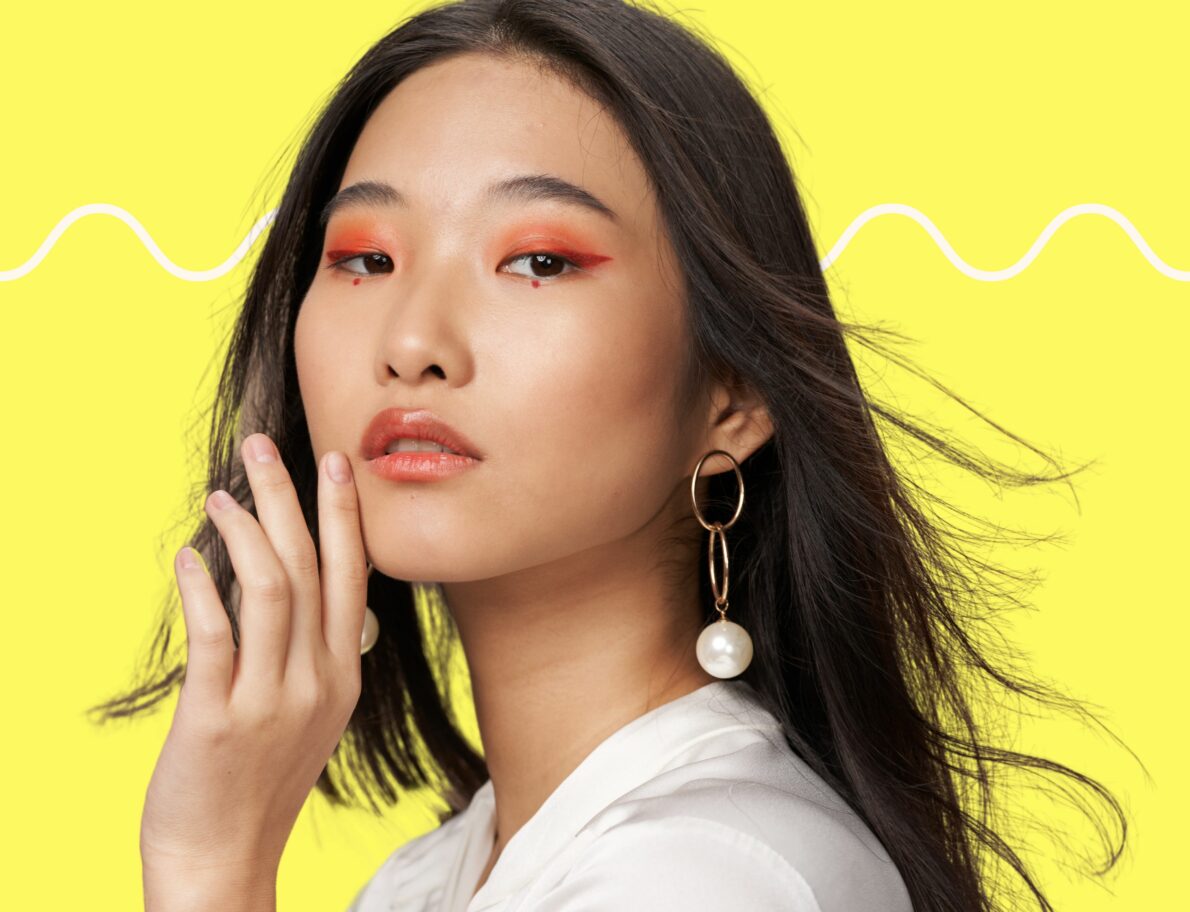 asian model in front of yellow background in image for Beauty Industry Trends and news from Lyon Content