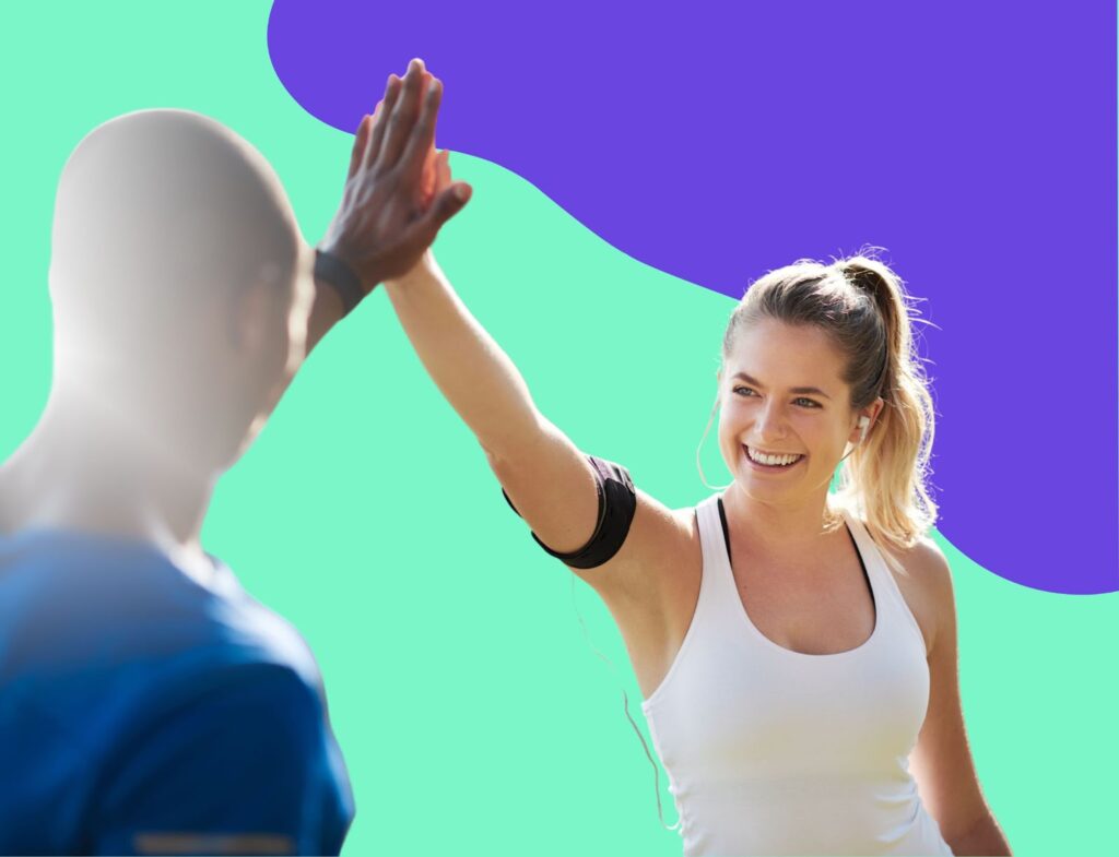Woman in workout gear giving man high five for Lyon Content article about building relationships with your LinkedIn strategy 