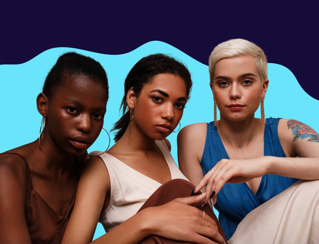 Women with different skin colors posing together for Lyon Content article about diversity in beauty marketing