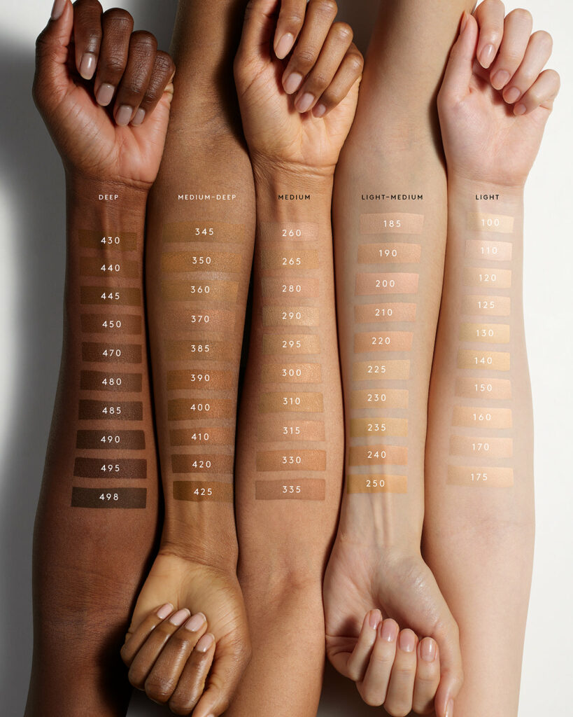 Photo of Fenty Soft'Lit foundation shade swatches on five different arms